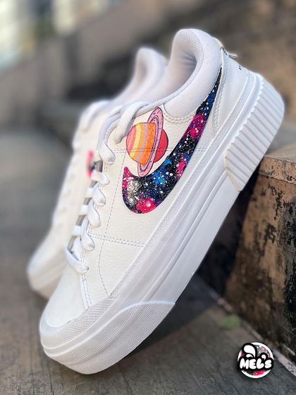 Another look at the Saturn-adorned galaxy swoosh on a pair of custom Nike platform sneakers.