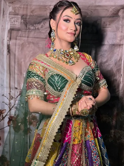A makeup artist's work on a model wearing our multi-color Navratri lehenga. The close-ups on the makeup are perfect for an MUA's social media.