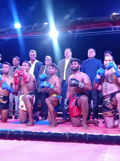 The pro fighters taking a knee in a traditional sign of respect before the competition.