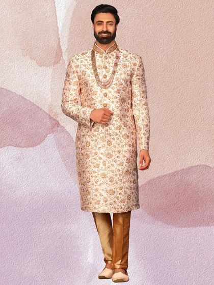 A closer look at the fine floral embroidery on this ivory sherwani. It's the small details that make an outfit truly special.