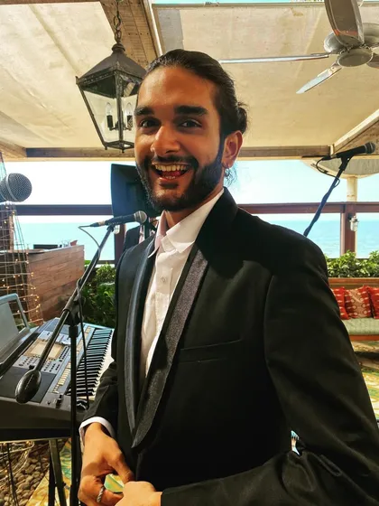 All smiles before the gig starts. Our vocalist Aryaman looking happy and ready to perform at a daytime event.