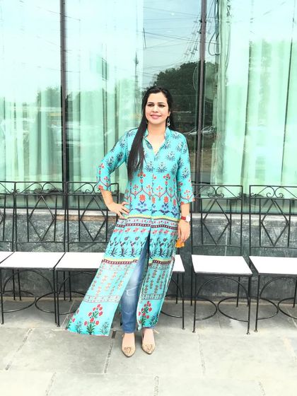 This long turquoise kurta paired with jeans is a great example of a simple fusion look. It's comfortable, stylish, and perfect for a casual day when you want to wear something ethnic but not too traditional.