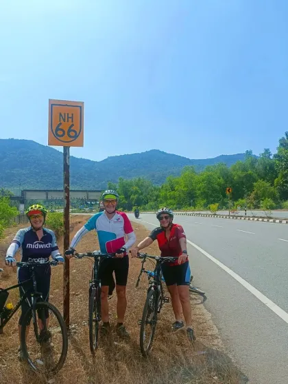Marking a milestone on National Highway 66. This photo captures the sense of accomplishment and camaraderie on our West Coast cycling adventure.