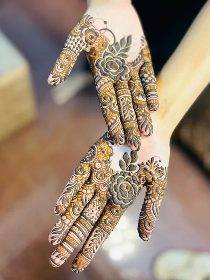Another pose with the same stylish design, showing how the patterns on both hands create a beautiful mirrored effect.