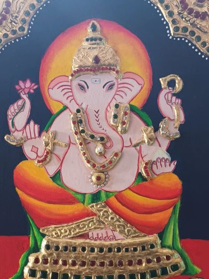 A close-up of a Tanjore painting of Lord Ganesha, created by my student Indu. Note the detailed gold foil work and stone embellishments that are characteristic of this style.
