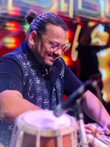 Our percussionist, in his element, driving the rhythm with a smile.