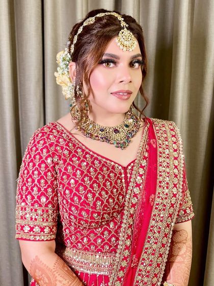 A close-up portrait focusing on her face, showing the soft contour and glowing highlight.