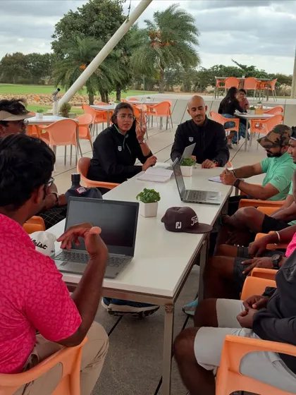 A coach makes a point during our monthly review. These discussions are vital for planning everything from off-season training to pre-season preparation.