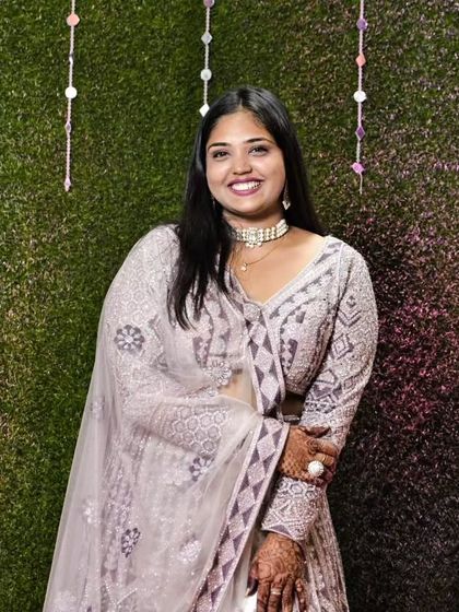 Our client smiling brightly in the lavender embroidered lehenga. It's a unique and elegant color that is sure to get you compliments.