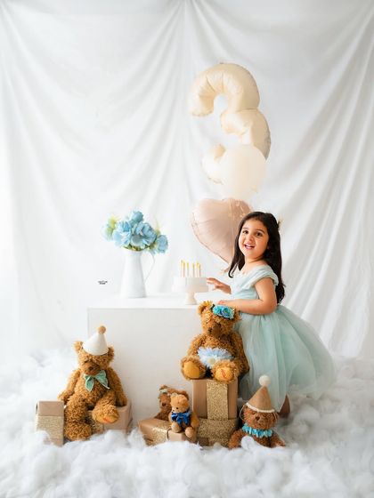 A wide shot of the entire dreamy teddy bear birthday setup for this little girl's third birthday celebration.