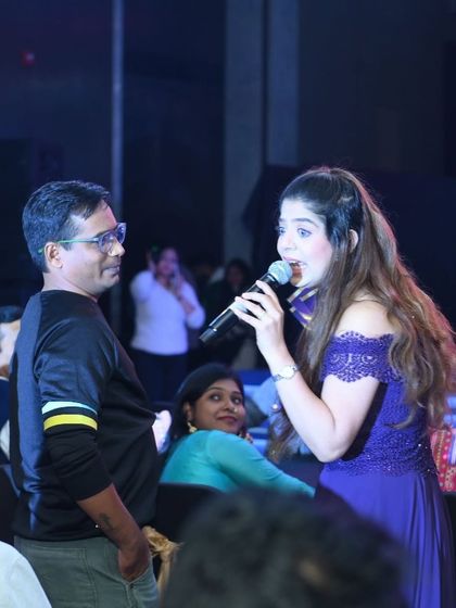 An interactive moment with a guest at the Mankind Pharma event. I love getting off the stage and into the crowd.