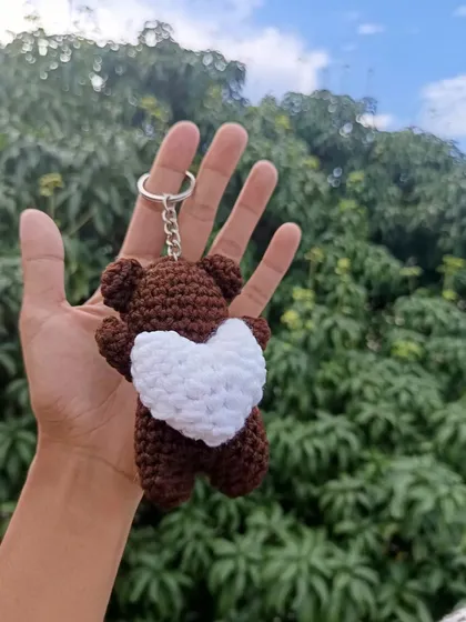 A custom brown bear keychain holding a white heart. This was a lovely color combination requested by a client.