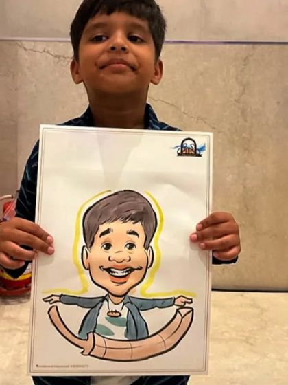 A young boy with a creative caricature that shows him balancing on a crescent moon. I love adding imaginative twists.