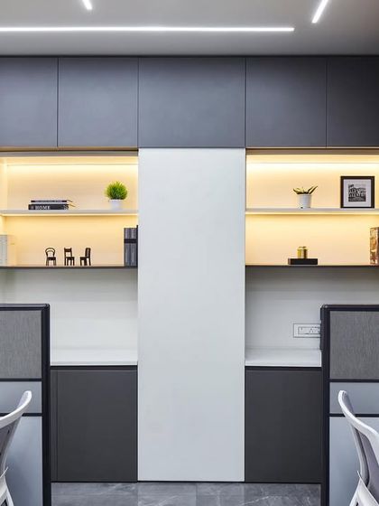 Even utility spaces can be stylish. The reprographic area features ample storage with warm, under-shelf lighting and curated decor, proving that functionality and aesthetics can coexist in every corner of an office.