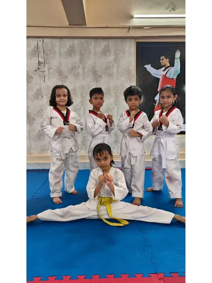Our little champions are all smiles. We build a strong team spirit where kids support each other, have fun, and develop amazing flexibility and strength together.