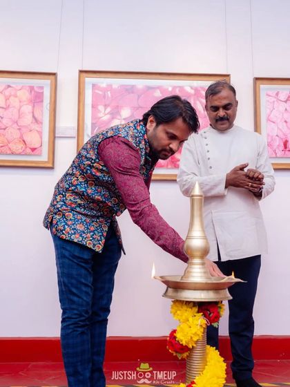 Here we are inaugurating the exhibition with the traditional lighting of the lamp. It was a moment of shared respect for the arts and the talented individuals showcasing their work.
