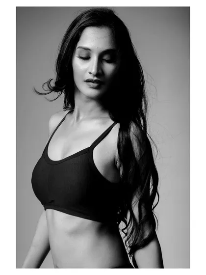 A soft and emotive black and white portrait, showing a more vulnerable side.