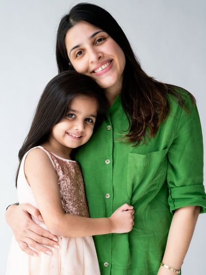 A mother and her older daughter sharing a warm hug. My sessions are for kids of all ages, and it's always beautiful to capture the evolving bond between a mother and her child.