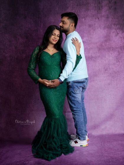 A sweet and tender moment. The partner's gentle kiss on her forehead conveys so much love and anticipation.