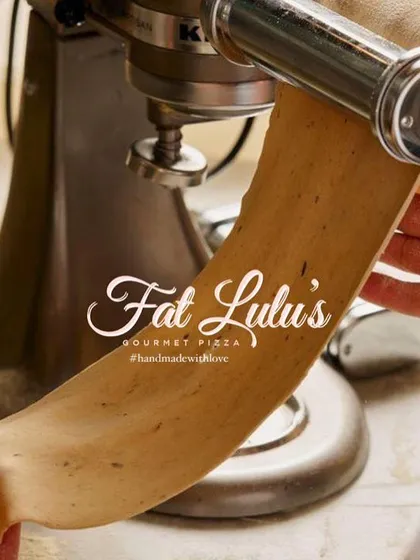 I use a traditional pasta maker to roll out my fresh dough, ensuring every strand of fettuccine has the perfect texture.