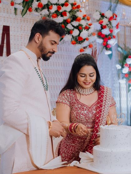 The cake-cutting moment from the ring ceremony. The makeup is designed to last through all the activities of the celebration.