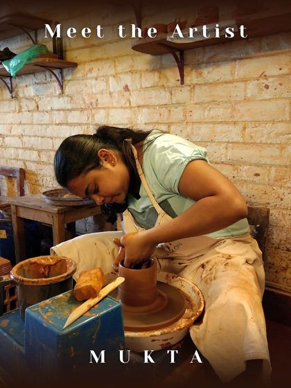 A photo of Mukta at the pottery wheel, finding her balance and expressing it through clay.