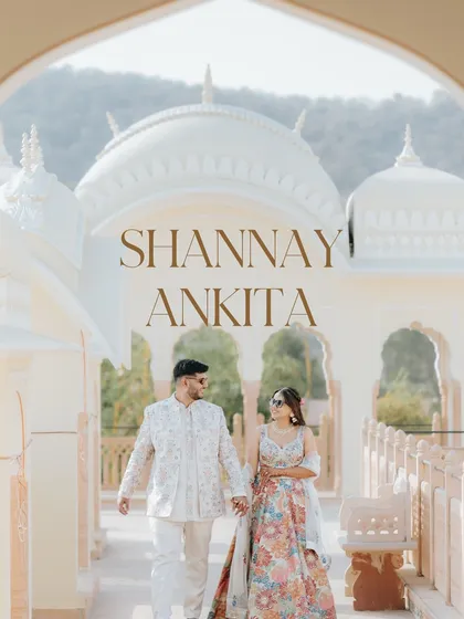 A classic portrait of the couple walking through the arched corridors of The Jaibagh Palace in Jaipur. The golden light and royal architecture create a timeless and romantic image.