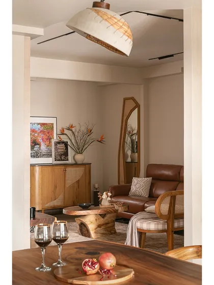 Since this home had no defined foyer, I introduced an asymmetric arch to visually separate the entryway from the living area. This view from the dining room shows how the spaces flow together while maintaining their own identity.