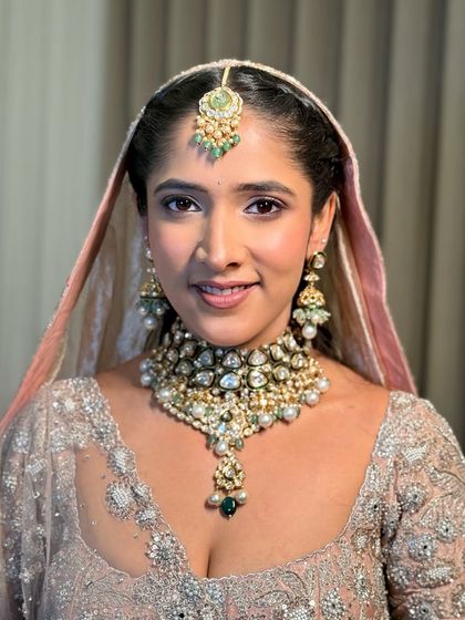 A close-up portrait of Anmol. Her makeup is subtle yet impactful, a style I call "understated luxury."