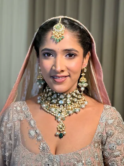 A close-up portrait of Anmol. Her makeup is subtle yet impactful, a style I call "understated luxury."