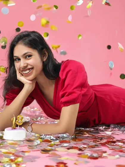Turning eighteen is such a big milestone. We wanted to capture the pure joy and excitement of this moment. This fun, vibrant shot with falling confetti is from a pre-birthday celebration in our studio.
