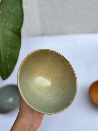 The interior of the Green Celadon fruit bowl. Notice the small blue spot, a happy little surprise from the kiln.
