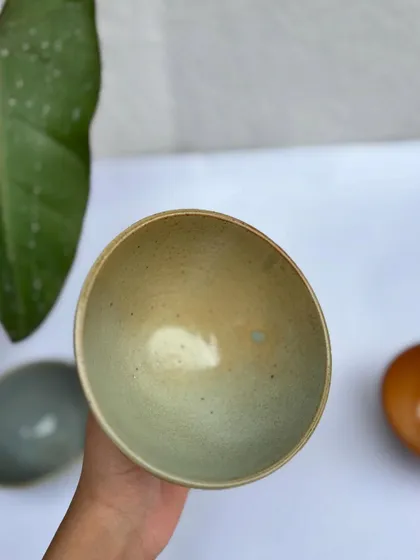The interior of the Green Celadon fruit bowl. Notice the small blue spot, a happy little surprise from the kiln.