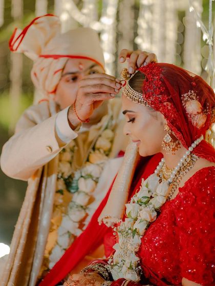 The sacred sindoor moment. A close up that captures the emotion and the beautiful details of the bride's makeup and hair.
