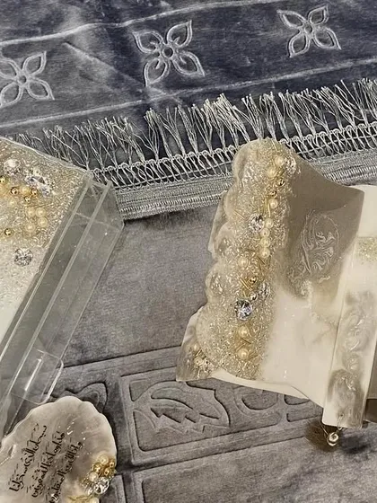 This video showcases the details of my silver-themed Islamic gift set. It includes a Quran holder and box with a beautiful silver and white resin pour, a crystal tasbeeh, car hanging, and a premium prayer mat.