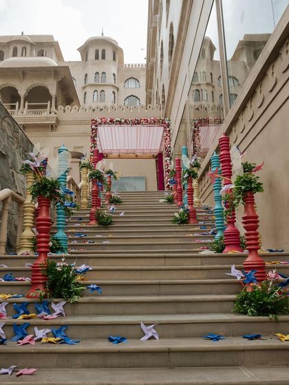 A view up the decorated staircase, showing how every part of the venue is used to build excitement and immerse guests in the carnival theme.
