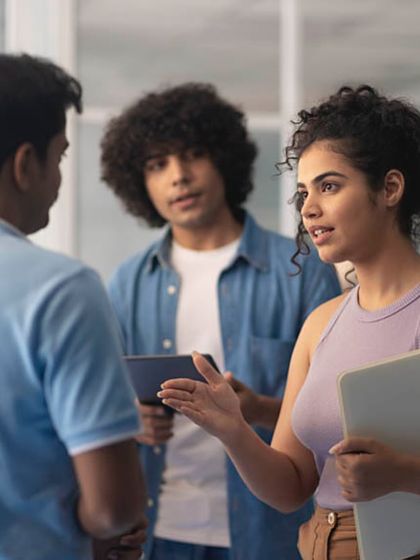 In this shot for Images Bazaar, I'm in a collaborative discussion scene. It highlights my skill in acting and interacting naturally with other models to create believable workplace scenarios.