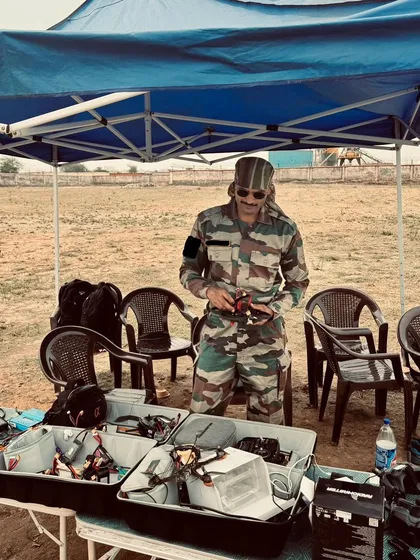 A soldier prepares his FPV drone and gear for a training exercise. We provide all the necessary equipment, from the drone itself to controllers and carrying cases.
