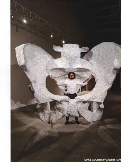 This is 'KAMA', a monumental sculpture of a female pelvic bone crafted from thousands of marble blast stones. It is an interactive piece, a tribute to womanhood and creation, inviting viewers to step inside a space of origin and contemplation.