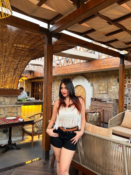 Another look at my outfit and the cafe's decor. This creates a cohesive story that blends fashion and lifestyle.