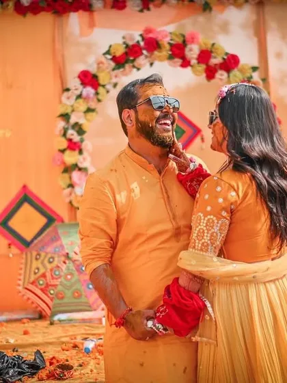 A sweet, candid interaction between the couple during their Haldi ceremony. Our photographers are skilled at capturing these quiet, intimate moments amidst the celebration.