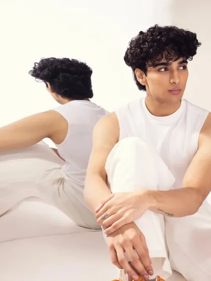 A close-up of the casual look, showing his natural hair texture and clean skin.