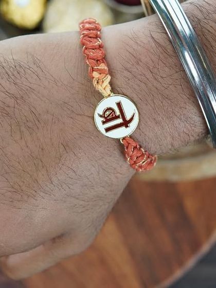 The 'Bro' Rakhi being worn. It's a simple, stylish, and heartfelt gift.