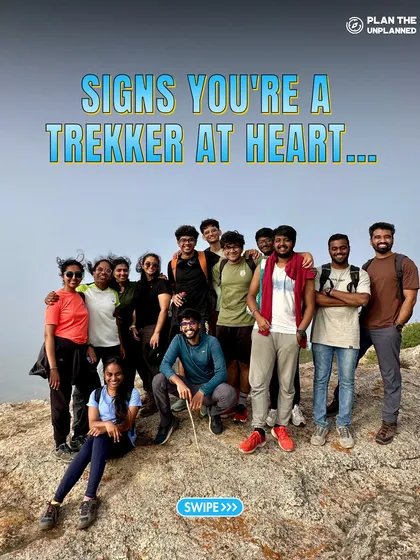 A group of trekkers at a summit, celebrating together. This is the first of a series showing the signs that you are a trekker at heart.