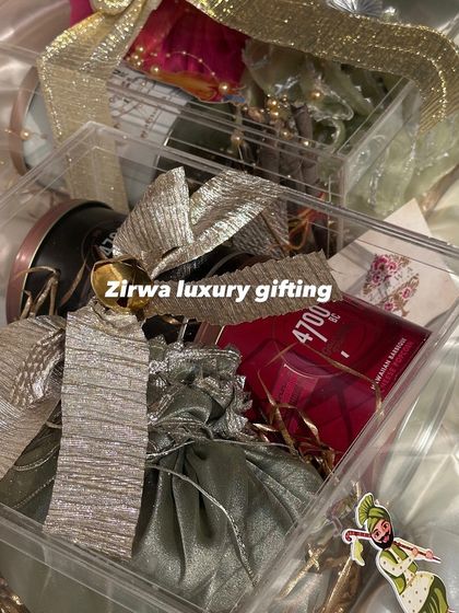 Another look at my Lohri return favours, this time in a clear acrylic box. The mix of a premium perfume and traditional potlis, tied with a large bow, makes for a modern yet festive gift.