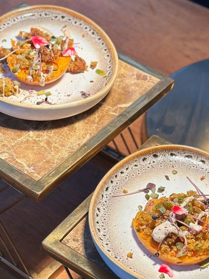 A beautifully plated dish of roasted butternut squash. The colours and textures are a feast for the eyes, promising a delicious and healthy meal.