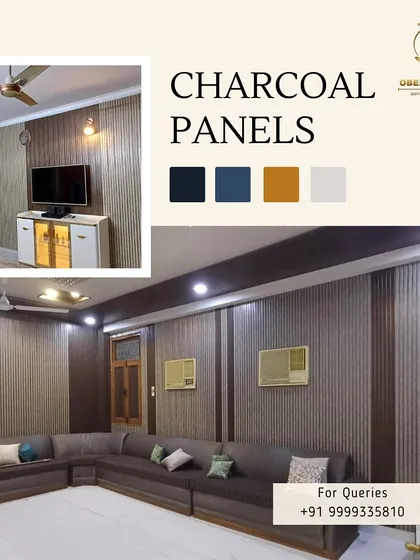 A living room featuring a full wall of our charcoal panels, creating a cozy yet modern backdrop for a large sectional sofa.
