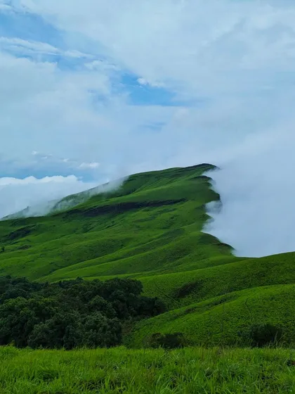 The iconic view of the Netravathi peak ridge, with clouds rolling in.