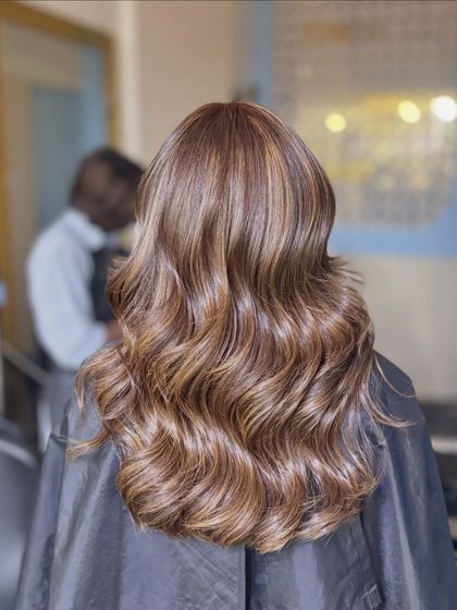 Presenting our Ginger Layers. This style combines warm ginger and brown tones with expert layering to create a full-bodied look with beautiful movement and texture.
