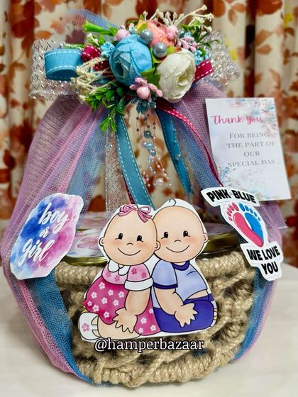 A beautiful jute basket hamper designed for a 'boy or girl' themed baby shower or a twin celebration.